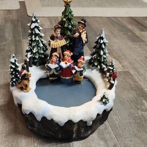 Holiday Village Scene with Carolers and Snowy Trees